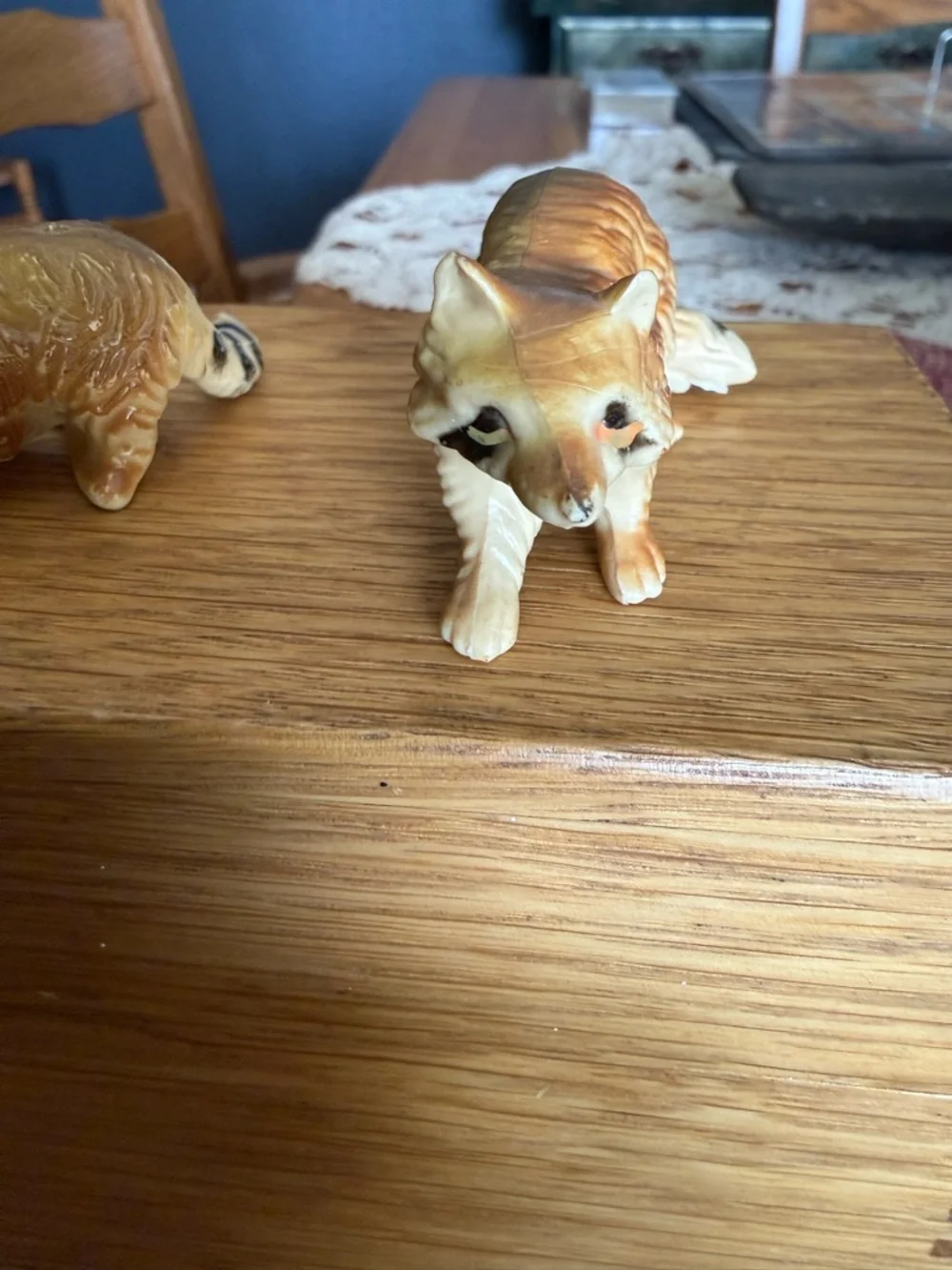 Mini pair of raccoon figurines